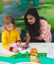 Child painting and exploring colors